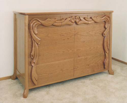 Carved cherry dresser
