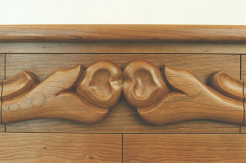 Carved cherry dresser top drawer detail